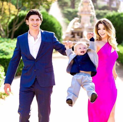 Landon Lusha with his parents, Masiela Lusha and Ramzi Habibi.
